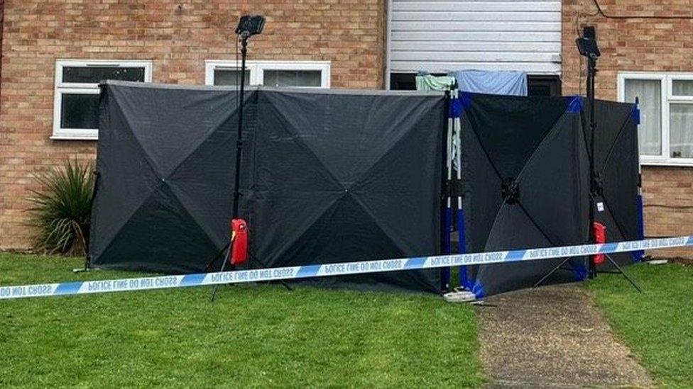 Shot of police tent in front of the door