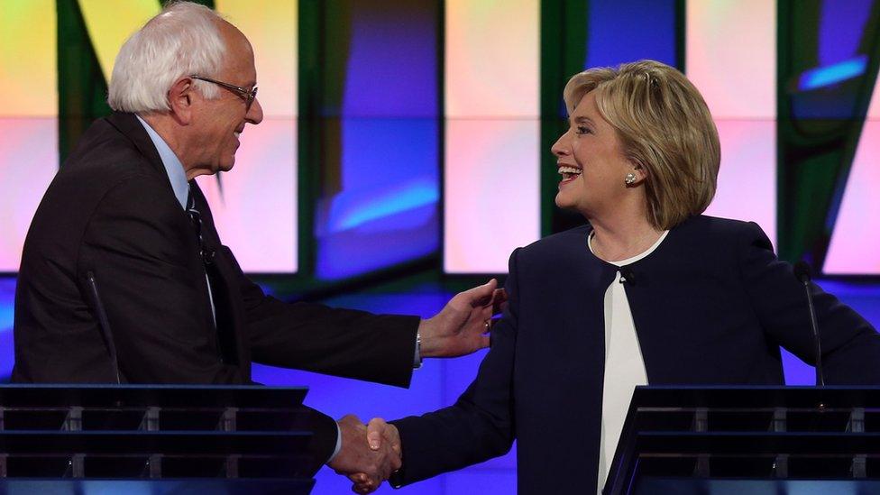 Democratic presidential candidates U.S. Sen. Bernie Sanders (I-VT) (L) and Hillary Clinton shake hands at the end of a presidential debate