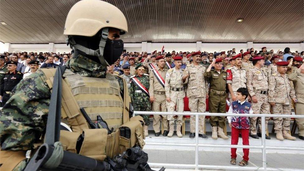 A Houthi militiaman stands guard