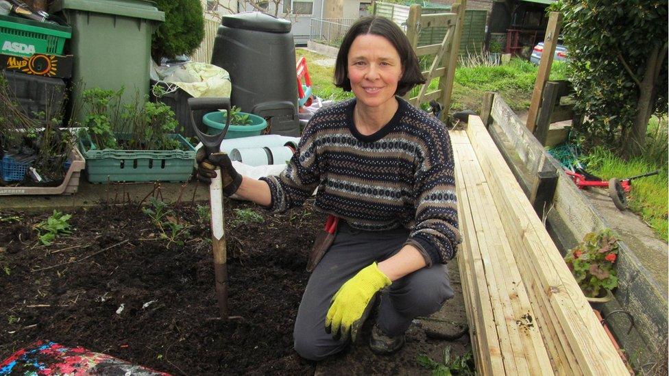 Tamasin Pemberton with spade and soil