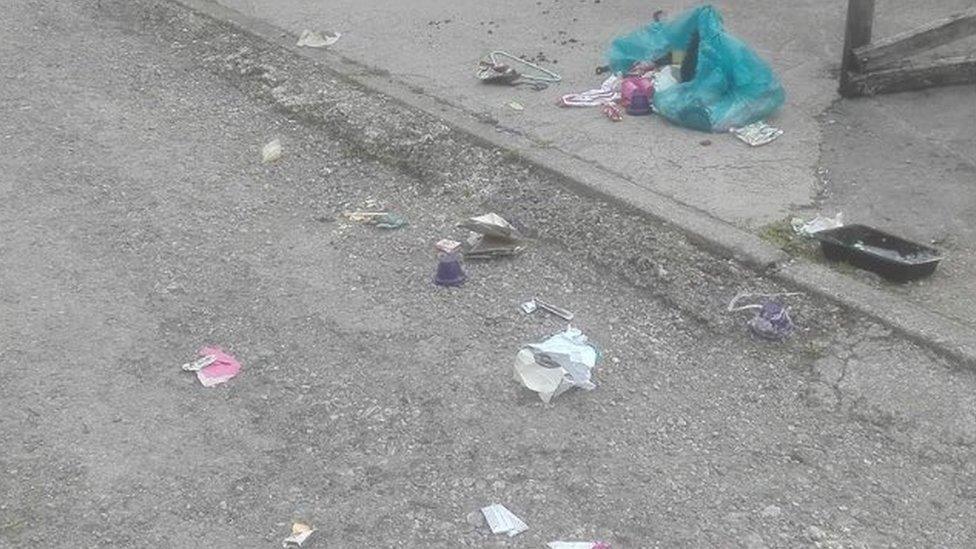 Rubbish strewn on floor in Bridgend