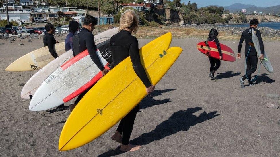 Surfers head to the sea in honour of the three foreign surfers murdered in Ensenada