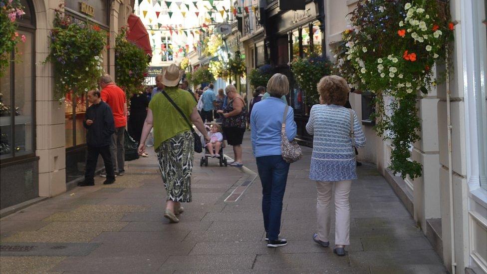 People in the Arcade in St Peter Port, Guernsey