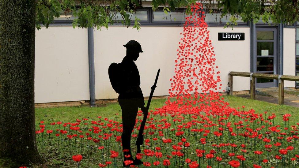 The poppy wave outside the school