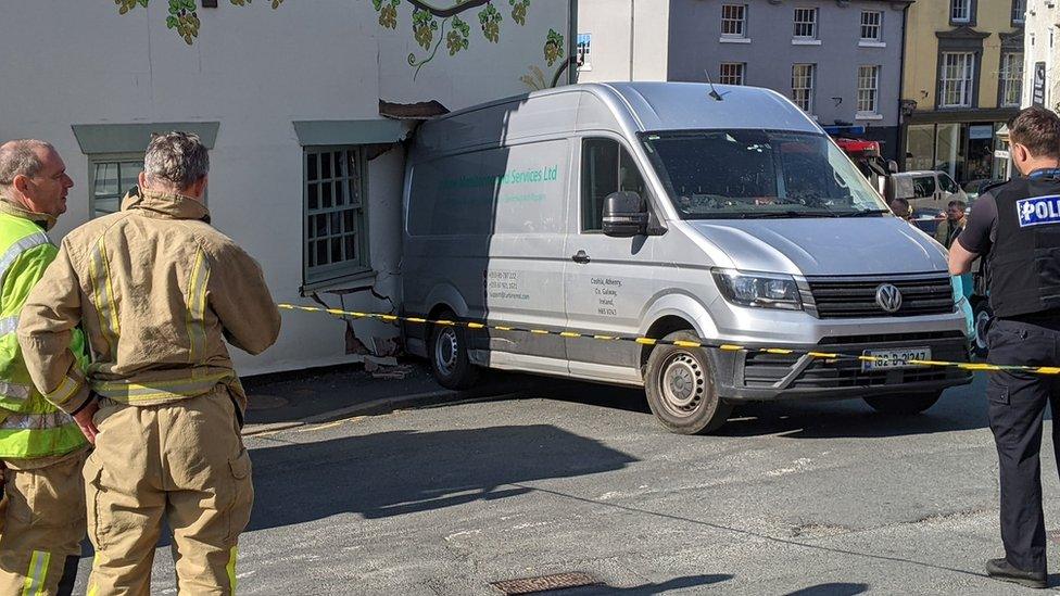 Collision involving a van and a building