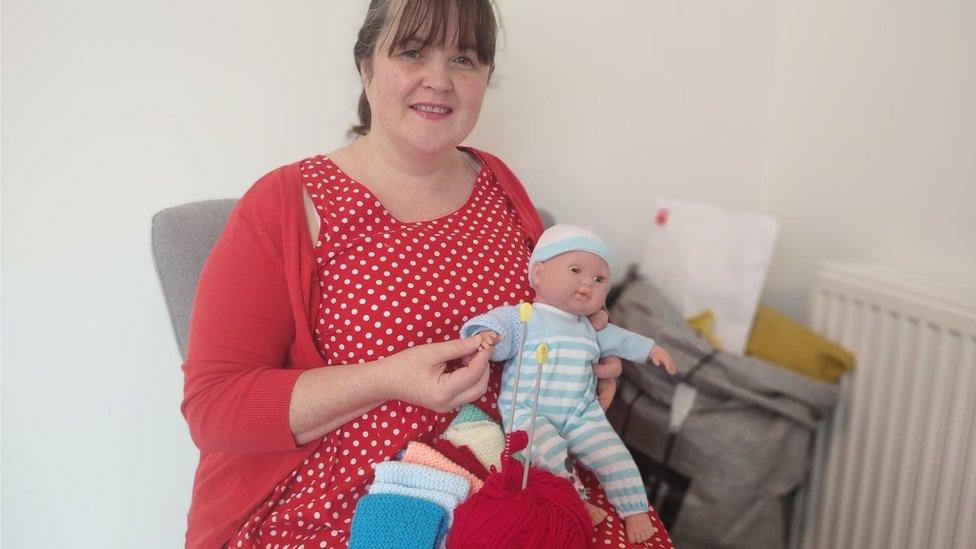 Catherine McConville holding some of the donations