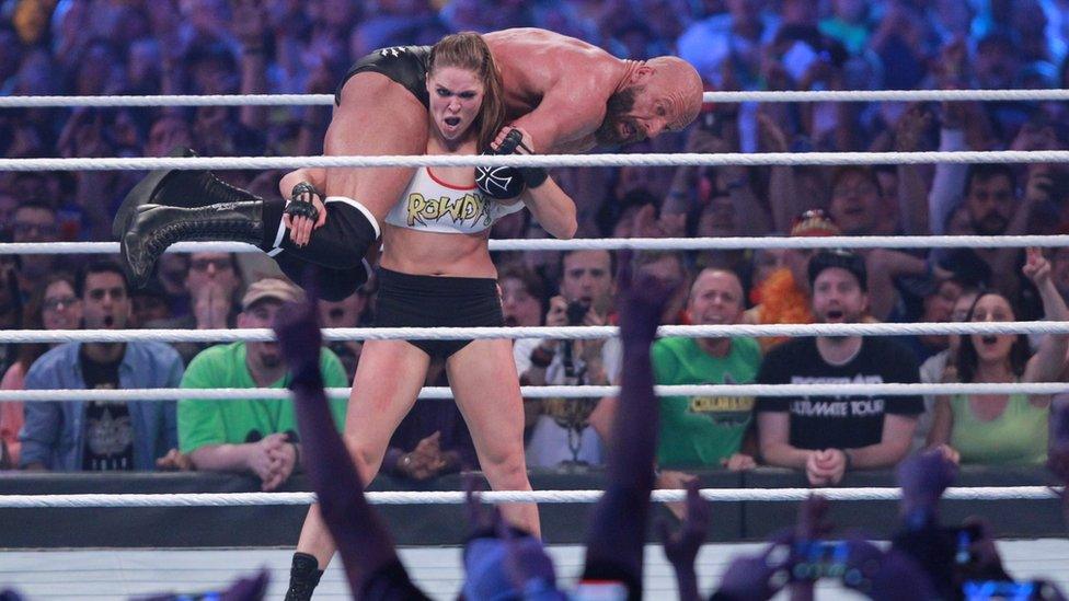 Ronda Rousey lifts Triple H