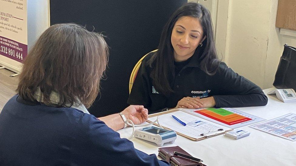 Woman carrying out blood pressure test at Pear Tree in Derby