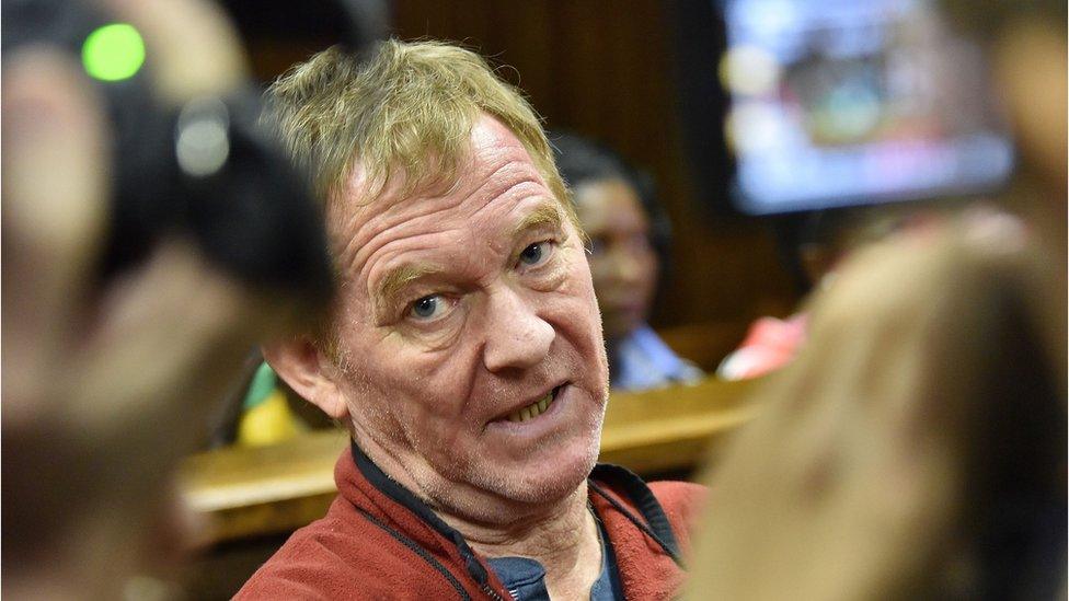 Danish man living in South Africa, Peter Frederiksen sits in the accused dock ahead of his bail application at the Bloemfontein Magistrate"s court on November 4, 2015.