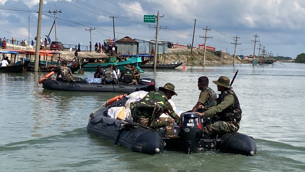 Rescuers in dinghies in Companiganj