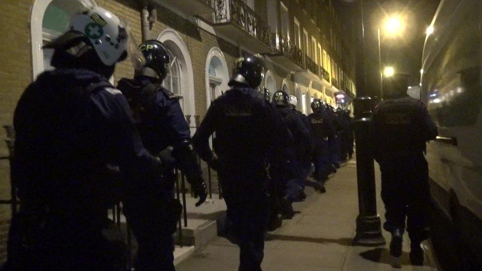 Police wait in street before raid at Kings Cross