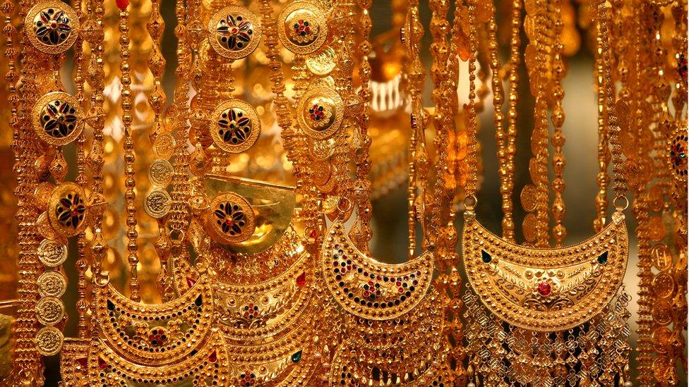 Rows of gold necklaces in Dubai's gold souk