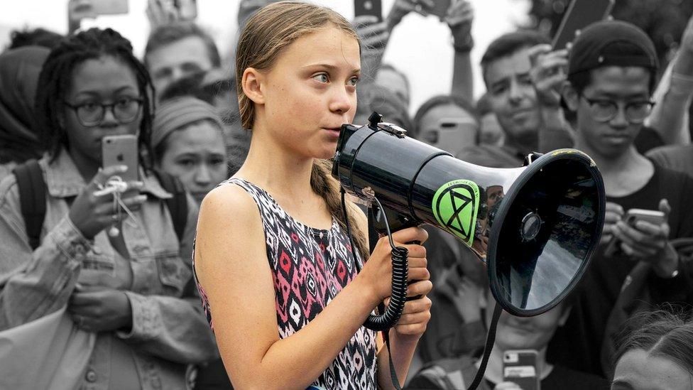 greta-thunberg-with-megaphone-in-crowd