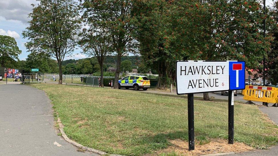 Image of a police car and cordon at Hillsborough Park