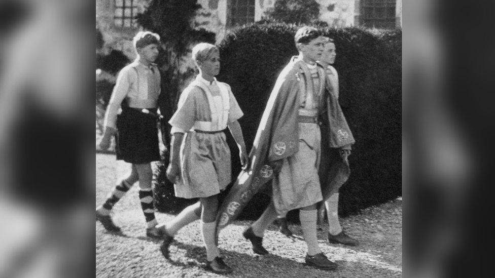 Prince Philip of Greece taking part in a historical pageant at school