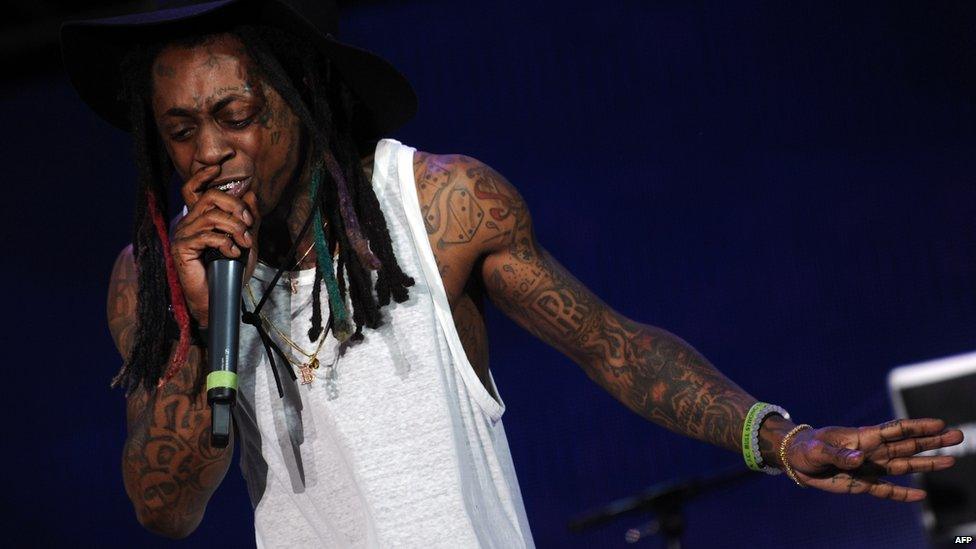 Gun attack on Lil Wayne's tour bus 'linked' to Birdman - BBC News