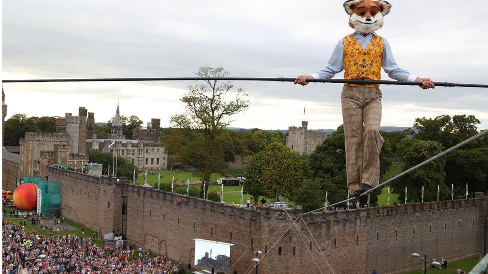 Mr Fox tightrope walks by Cardiff Castle