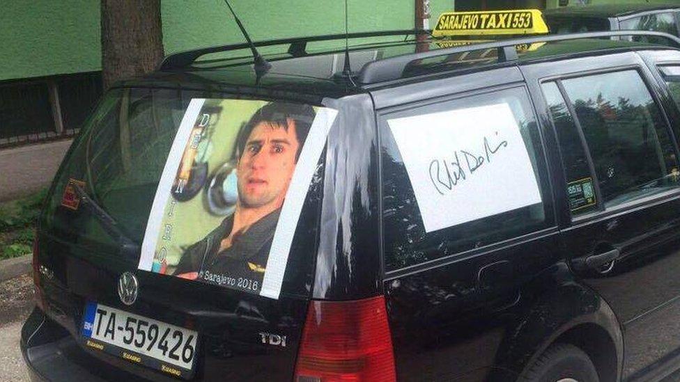 A Sarajevo taxi displays a picture of Robert De Niro