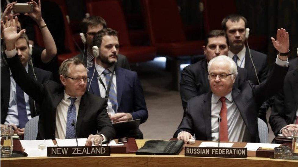 New Zealand ambassador to the UN, Gerard Jacobus van Bohemen (L) and Russian ambassador to UN, Vitaly Churkin (R) vote on a ceasefire in Syria at UN headquarters in New York, New York, USA, 31 December 2016.