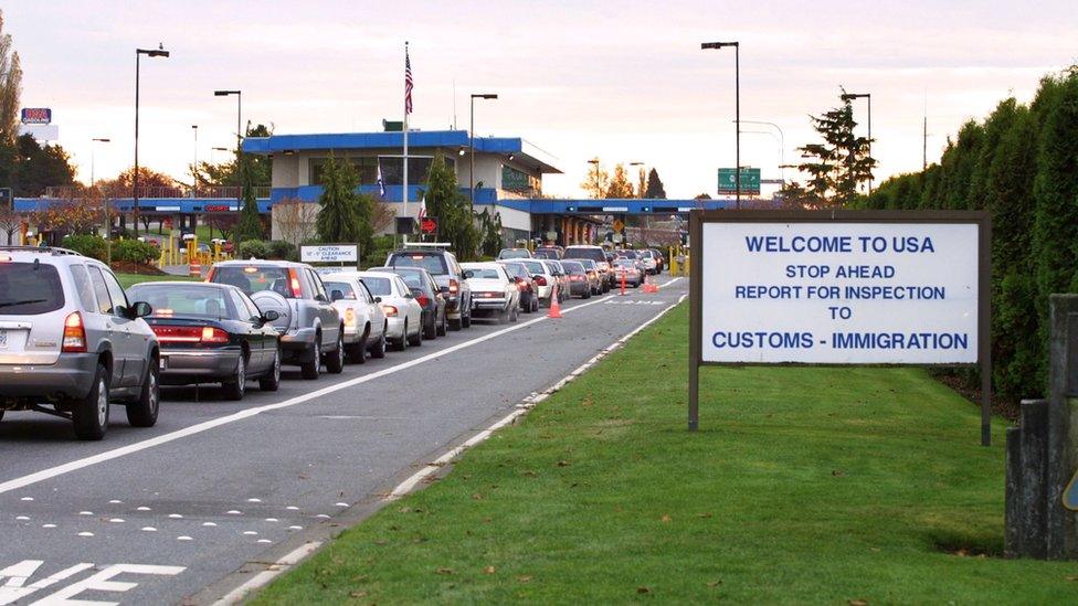 Cars queuing up to cross the border between the US and Canada.