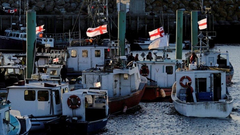 Fishermen from the Sipekne"katik First Nation work from a wharf after opposition from non-Indigenous fishers in Saulnierville, Nova Scotia