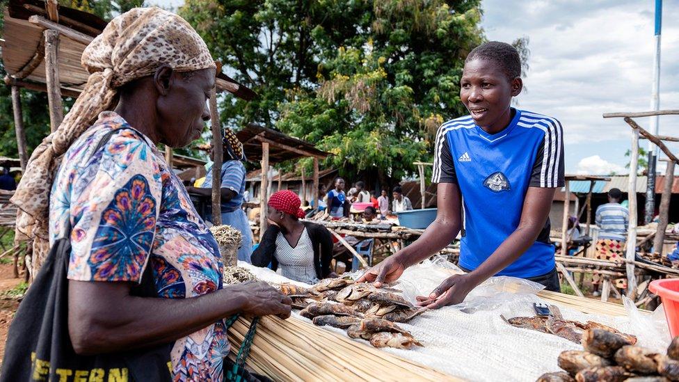 A Kenyan fishmonger selling Chinese fish