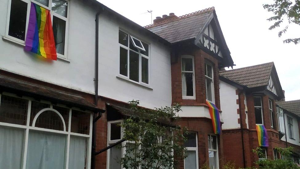 Rainbow flags hung out of windows