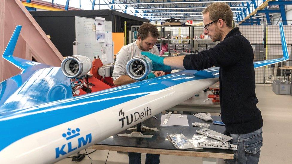 Engineers working on the Flying-V test aircraft