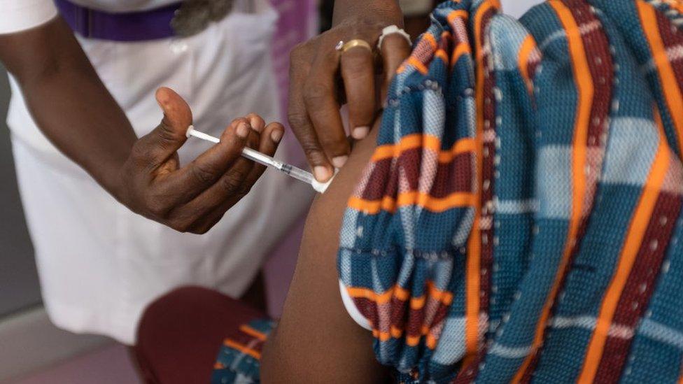 A person getting a vaccine in Ghana