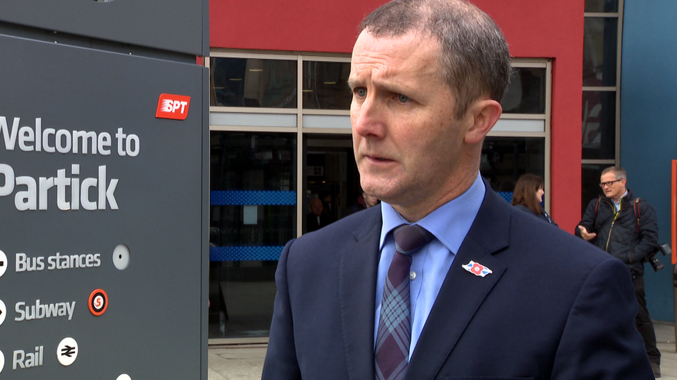 Michael Matheson being interviewed outside Partick subway station