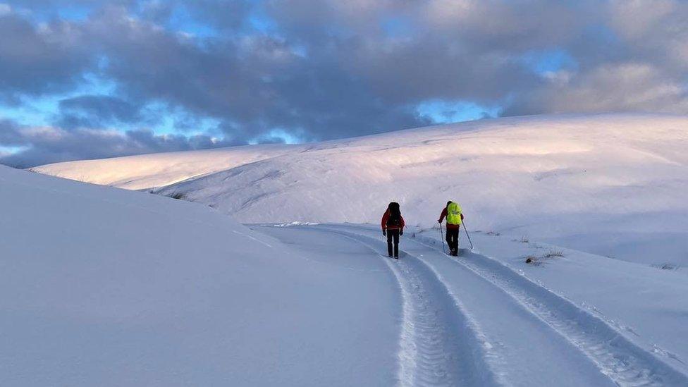 Rescuers in the snow