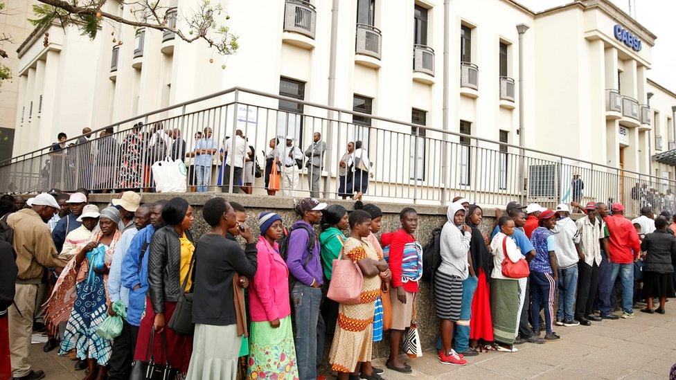 People queuing outside a bank in Harare, Zimbabwe, to get newly released notes - November 2019