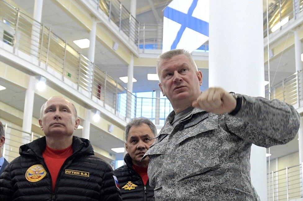 President Vladimir Putin (L) and Vice-Admiral Nikolai Yevmenov, commander of Russian Northern Fleet