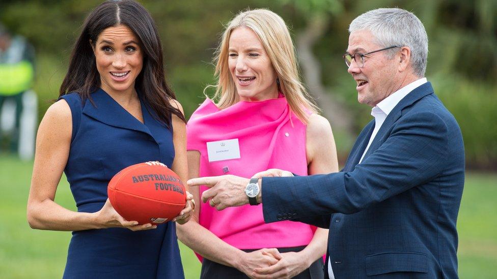 Meghan with an AFL ball