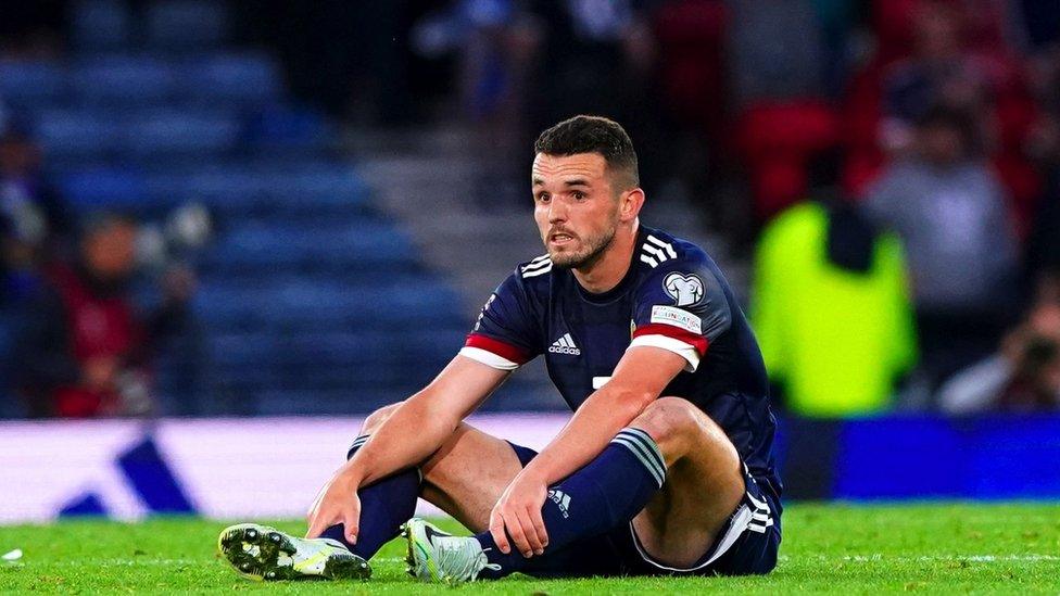 Scotland's John McGinn appears dejected at the end of the FIFA World Cup 2022 Qualifier play-off semi-final match at Hampden Park