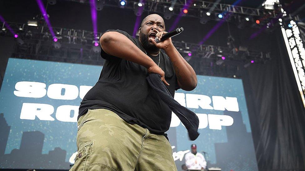 Image shows Killer Mike on stage in 2014