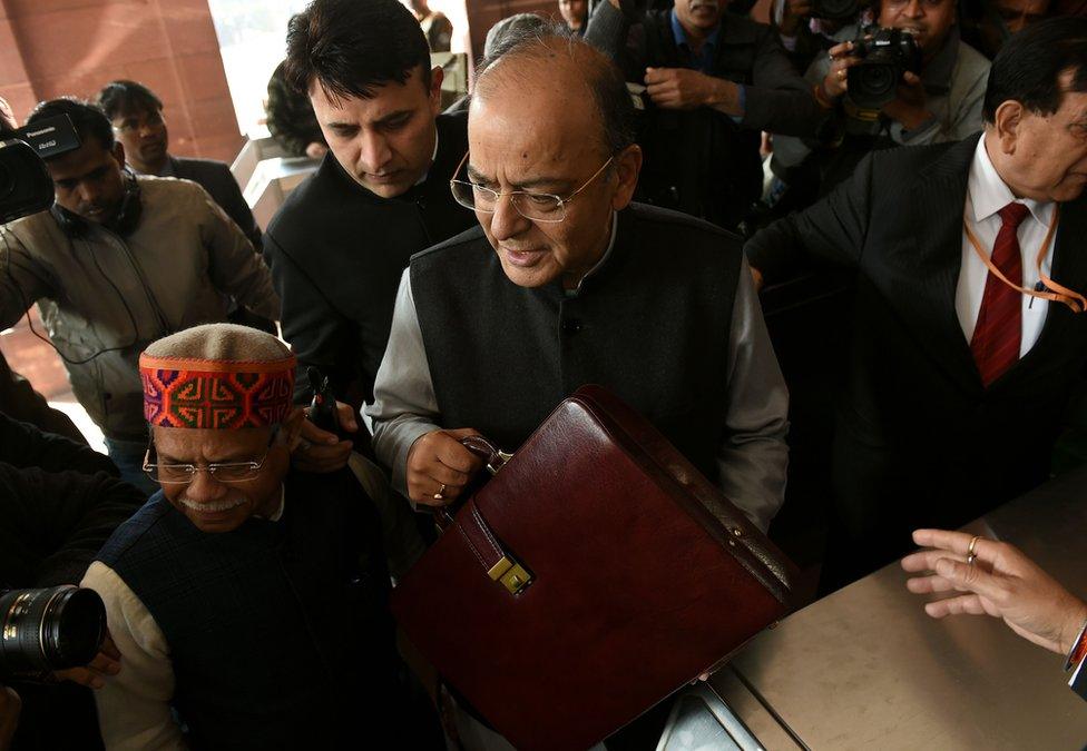 Indian finance minister Arun Jaitley arrives at Parliament House to present the budget