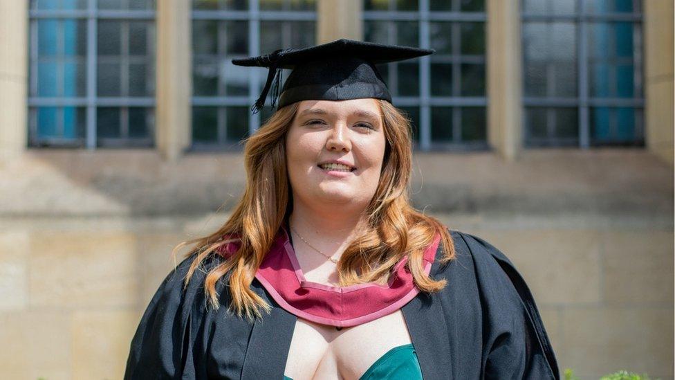 Chloe Fussell smiling wearing her graduation mortar board