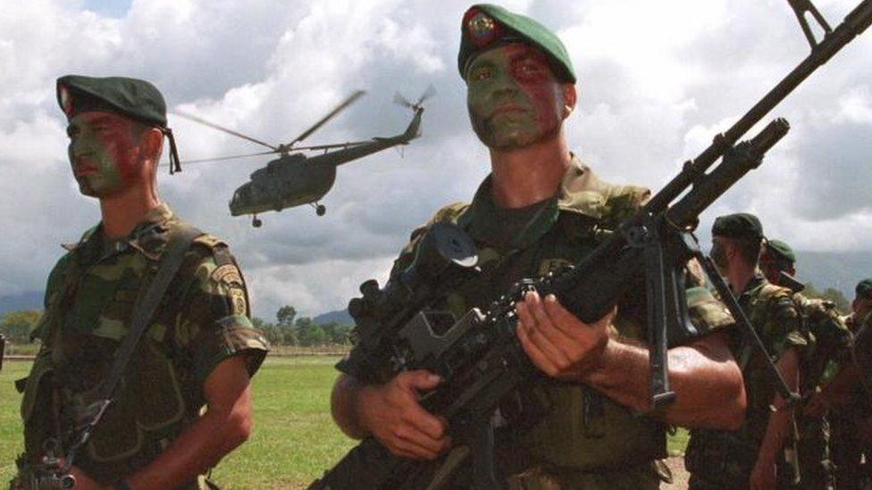 Troops wait to participate in their opening ceremony for the activation of a new special force to combat rebels at Tolemaida, a Colombian military base about 60 miles outside of Bogota, on Tuesday, December 7, 1999.