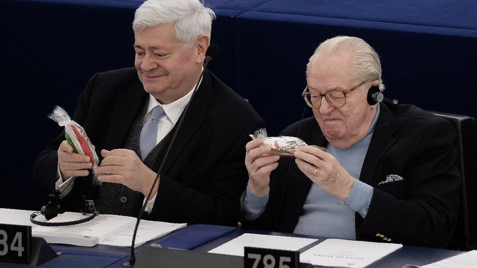 European Parliament member Bruno Gollnisch (L) and France's far-right political party Front National (FN) founder Jean-Marie Le Pen take part in a voting session at the European Parliament in Strasbourg, eastern France, on March 8, 2016.