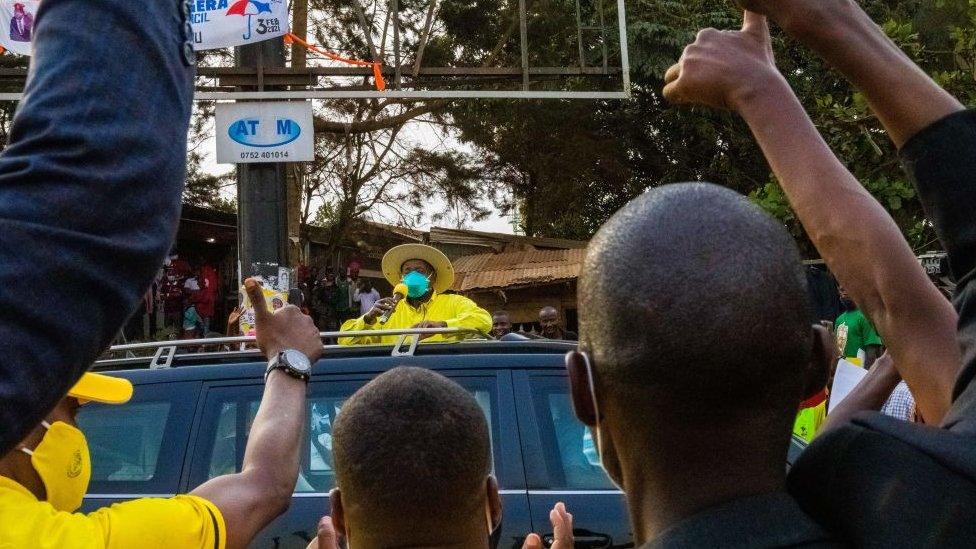 Yoweri Museveni greets his supporters