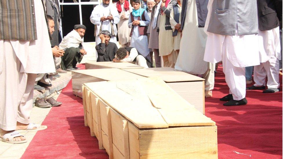 Relatives attend the funeral of the victims a day after a bomb blast at a Mosque in Kunduz, Afghanistan, 09 October 2021.