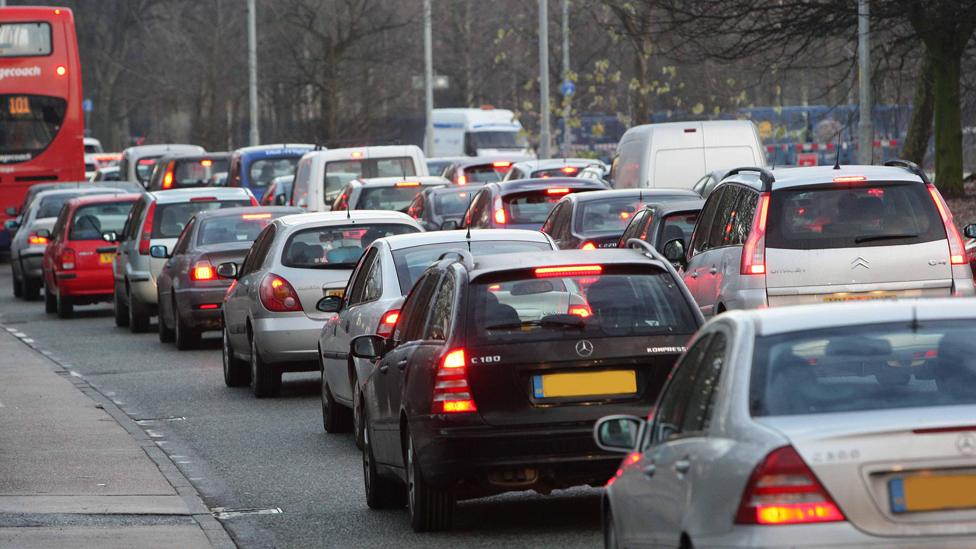 Early morning traffic builds up along the Princess Parkway into Manchester city centre.