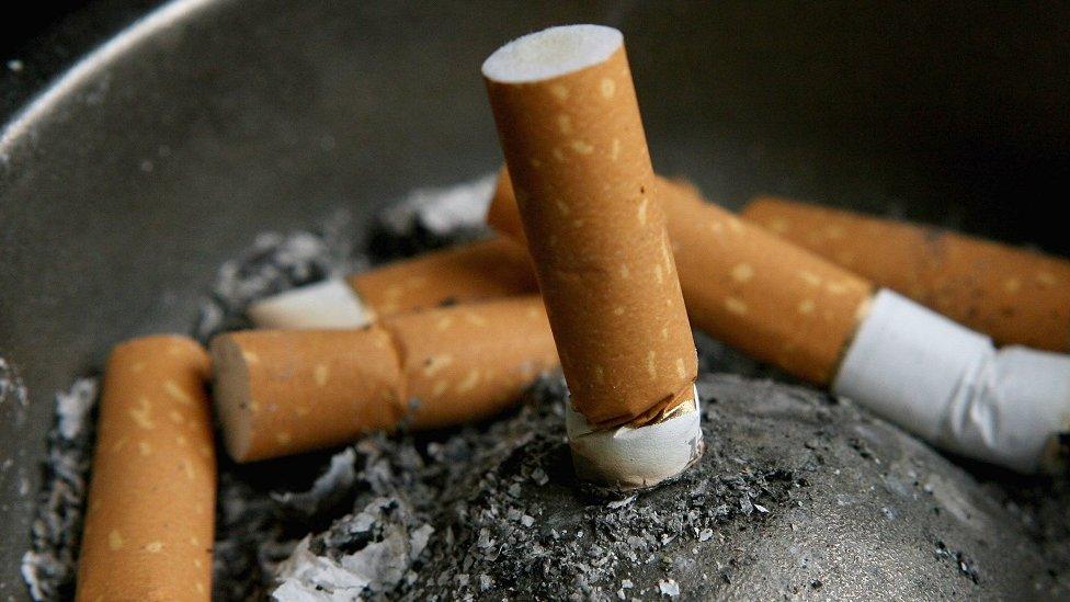 A ashtray containing stubbed-out cigarettes