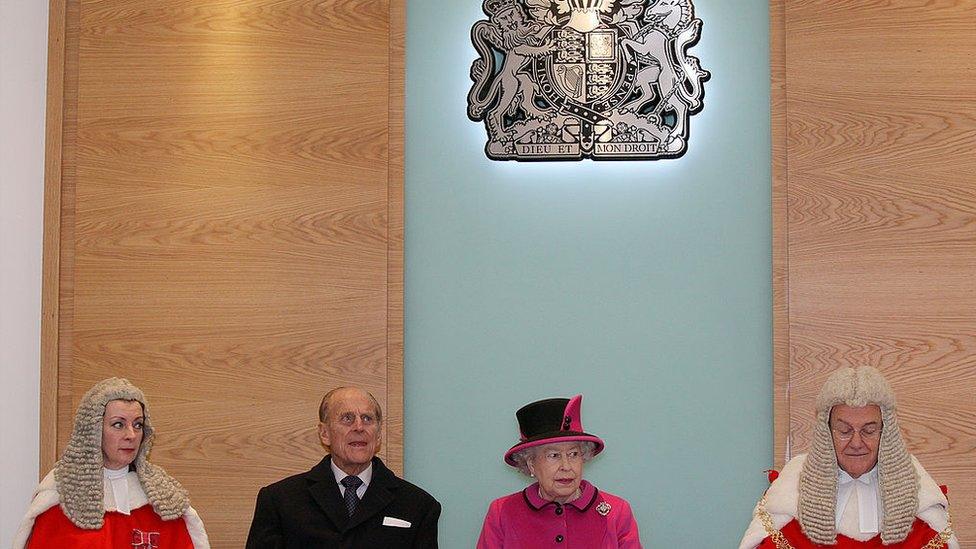 Queen Elizaberth II of England (C) and Prince Phillip Duke of Edinburgh (2L) officially open the magistrates court at the Warwickshire Justice Centre in Leamington Spa on March 4, 2011