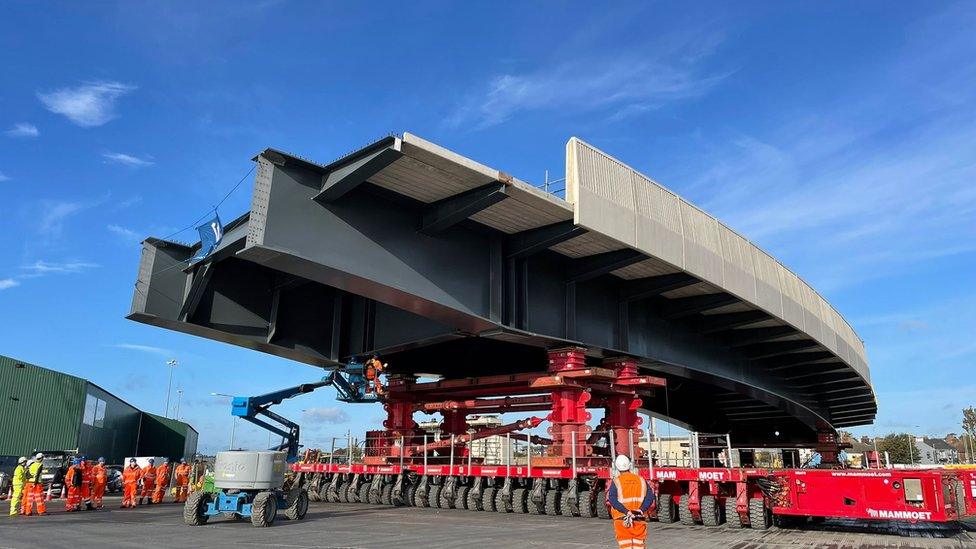 Bridge being moved by specialist equipment on the ground