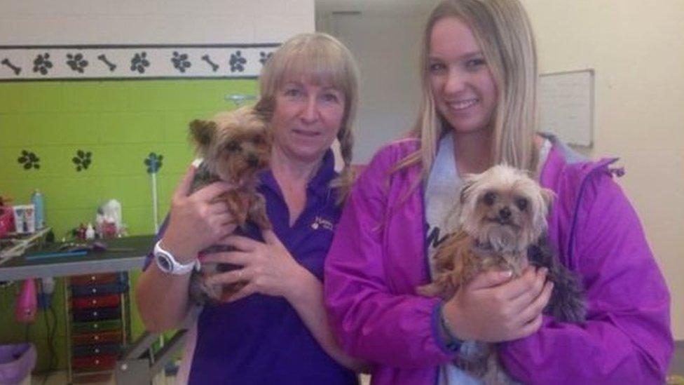 Happy Dogz staff pose with Boo and Pistol