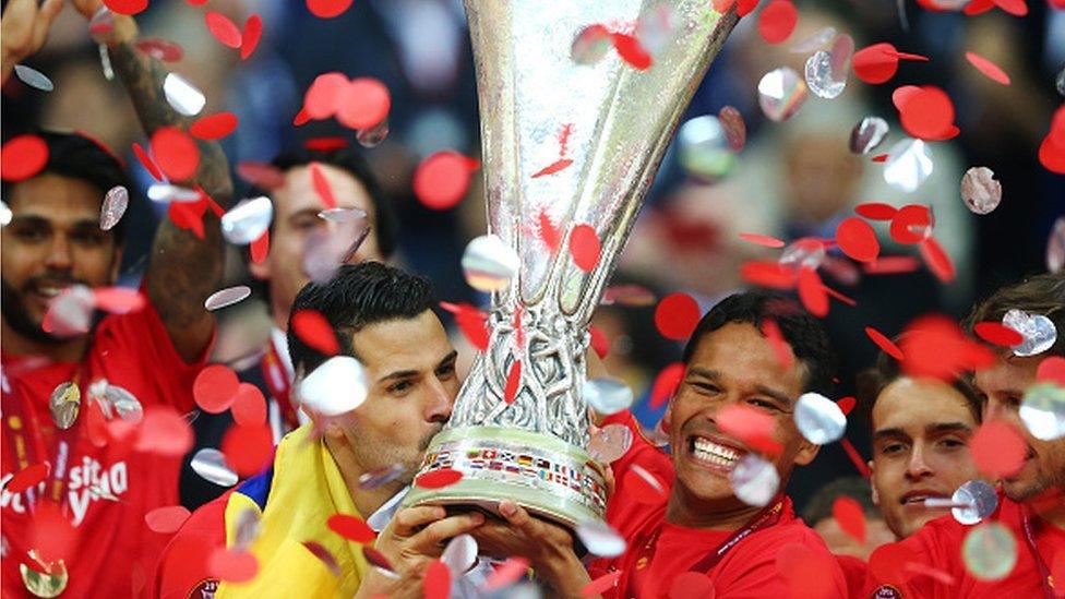 Sevilla's players celebrate after winning the 2015 Europa League