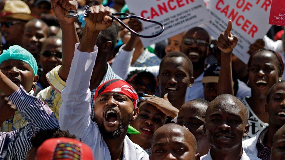 Doctor raises stethoscope during protest