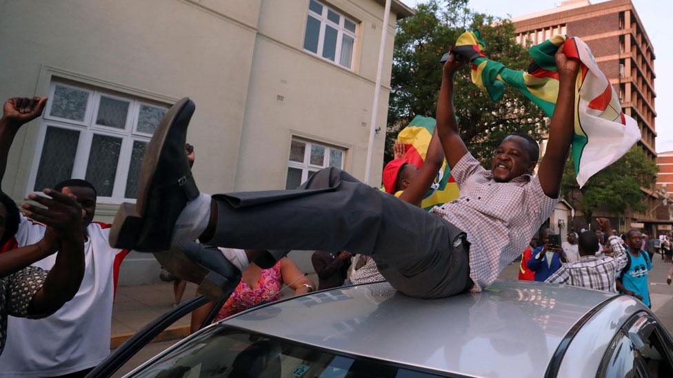 Man on car in Harare